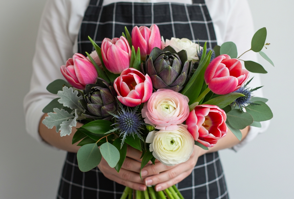 Women Holding a Mixed Bouquet with Tulips Women Holding a Mixed Bouquet with Tulips